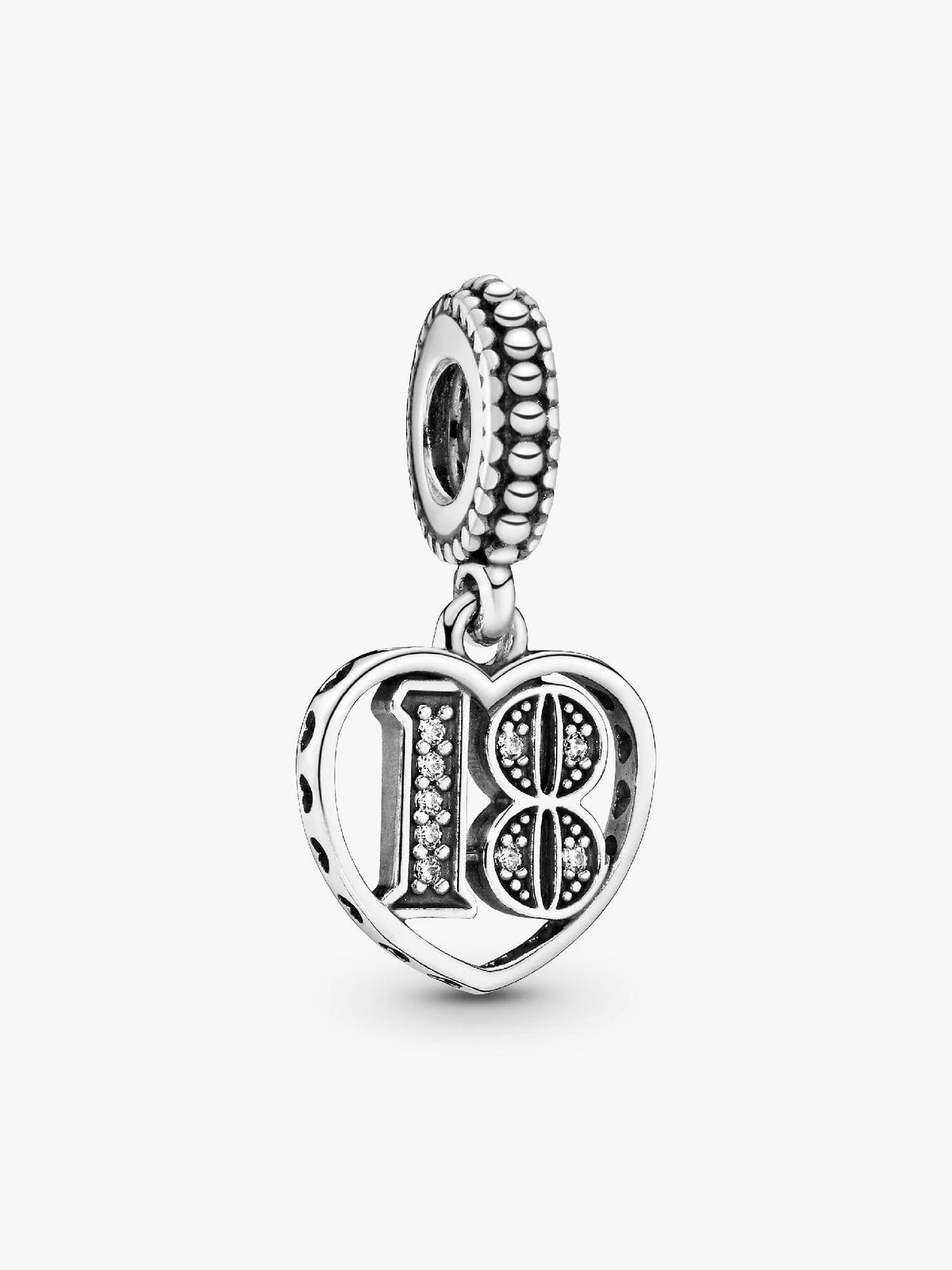 A silver 18th birthday charm featuring a heart-shaped pendant with the number 18 embellished with small clear crystals, suspended from a textured beaded top loop, shown on a light gray background.