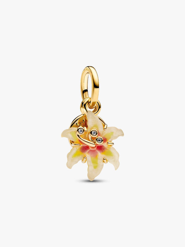 Gold pendant with a floral design on a white background